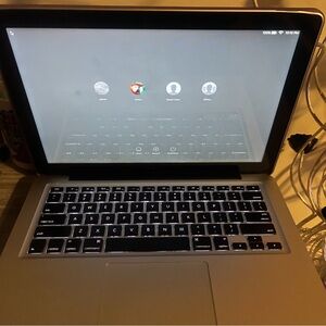Apple MacBook with Silver Body and Black Keyboard